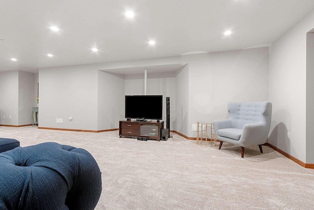 carpeted living room featuring baseboards and recessed lighting