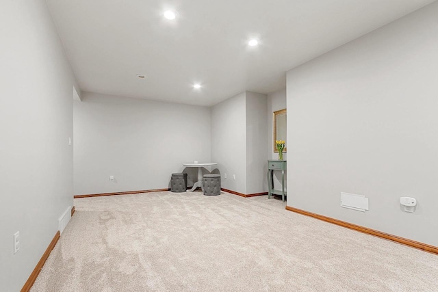 spare room with light carpet, baseboards, visible vents, and recessed lighting