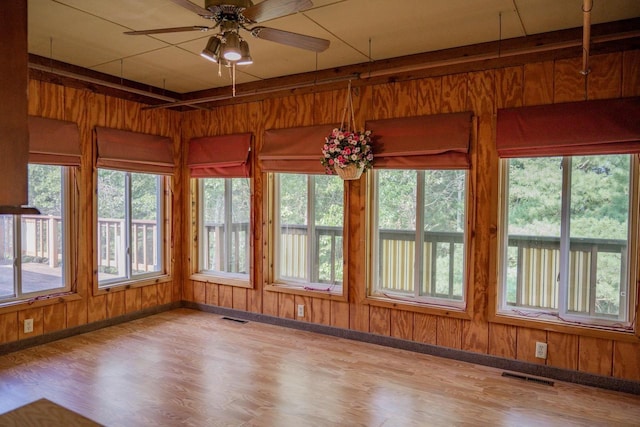 1930 Czech Ave, Arkdale, WI 54613 - unfurnished sunroom featuring plenty of natural light, visible vents, and wood walls