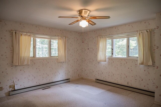 1930 Czech Ave, Arkdale, WI 54613 - carpeted empty room with wallpapered walls and a baseboard heating unit