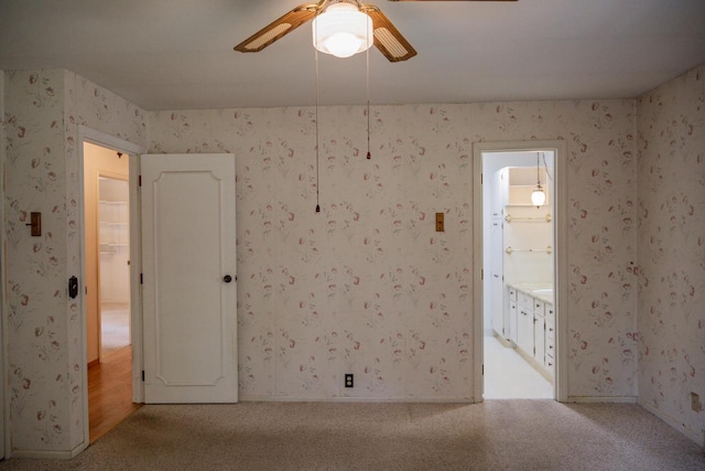 1930 Czech Ave, Arkdale, WI 54613 - spare room featuring light colored carpet, wallpapered walls, baseboards, and a ceiling fan