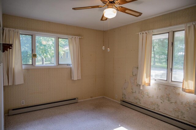 1930 Czech Ave, Arkdale, WI 54613 - unfurnished room with plenty of natural light, wallpapered walls, and a baseboard heating unit