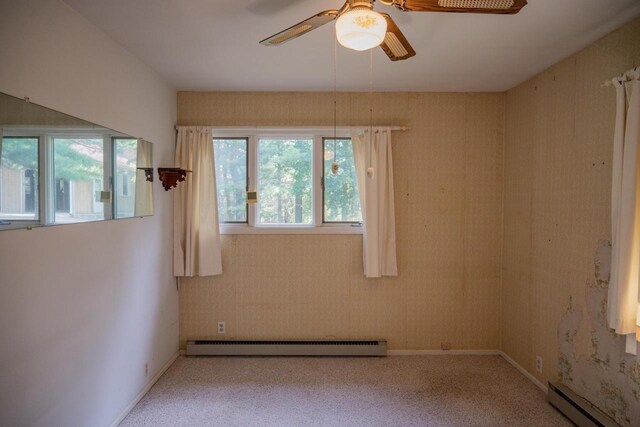 1930 Czech Ave, Arkdale, WI 54613 - empty room featuring a ceiling fan, a baseboard radiator, baseboards, a baseboard heating unit, and carpet