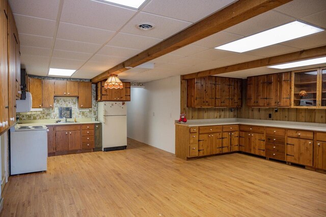 1930 Czech Ave, Arkdale, WI 54613 - kitchen featuring light countertops, white appliances, a sink, light wood-style flooring, and brown cabinets