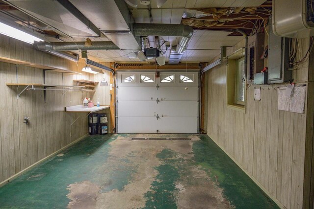 1930 Czech Ave, Arkdale, WI 54613 - garage featuring wood walls and a garage door opener
