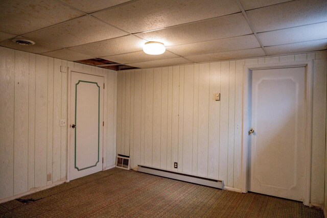 1930 Czech Ave, Arkdale, WI 54613 - empty room with wooden walls, baseboard heating, visible vents, carpet, and a drop ceiling