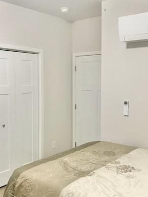 1501 N Windsor Ave Unit 205, Cottage Grove, WI 53527 - bedroom with a wall unit AC and a closet