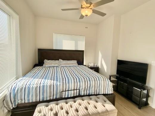 1501 N Windsor Ave Unit 205, Cottage Grove, WI 53527 - bedroom featuring wood finished floors and a ceiling fan