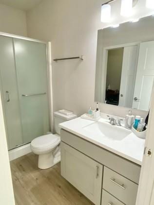 1501 N Windsor Ave Unit 205, Cottage Grove, WI 53527 - bathroom with wood finished floors, vanity, and a stall shower