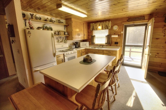 N16180 Deerfield Dr, Nekoosa, WI 54457 - kitchen featuring light countertops, open shelves, white appliances, wooden ceiling, and wooden walls
