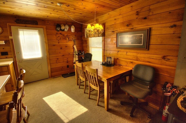 N16180 Deerfield Dr, Nekoosa, WI 54457 - dining room featuring a chandelier, wood ceiling, wooden walls, and light colored carpet