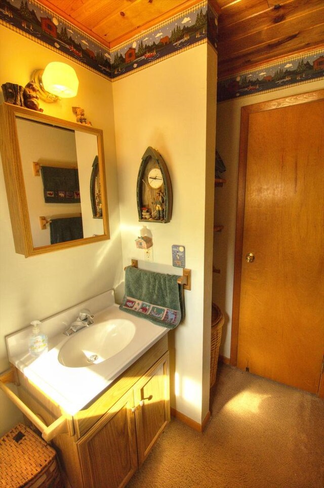 N16180 Deerfield Dr, Nekoosa, WI 54457 - bathroom featuring vanity, wooden ceiling, and baseboards