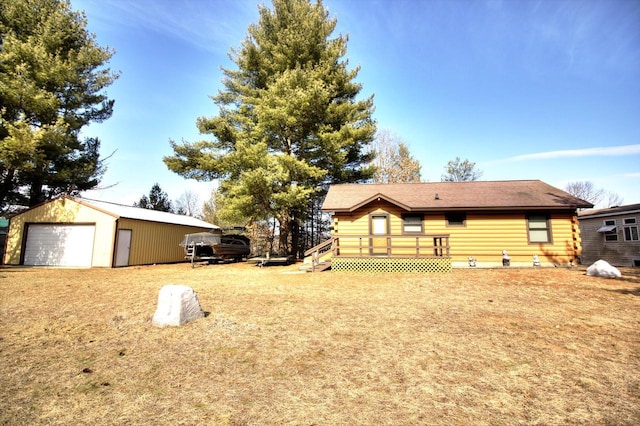N16180 Deerfield Dr, Nekoosa, WI 54457 - view of yard featuring an outbuilding, a deck, and a detached garage