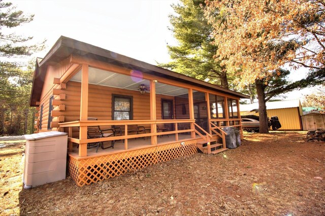N16180 Deerfield Dr, Nekoosa, WI 54457 - back of house featuring covered porch and log exterior
