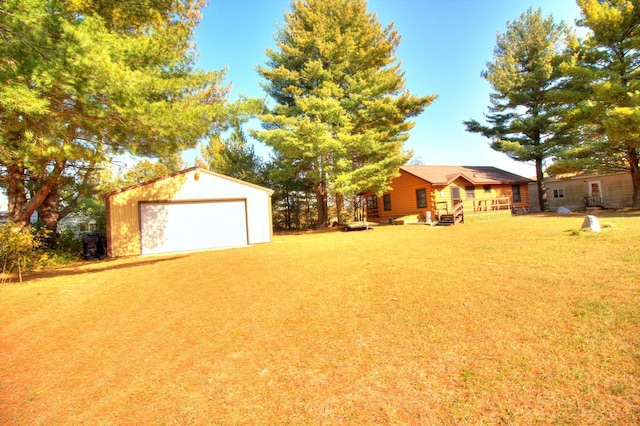 N16180 Deerfield Dr, Nekoosa, WI 54457 - view of yard featuring an outdoor structure and a garage