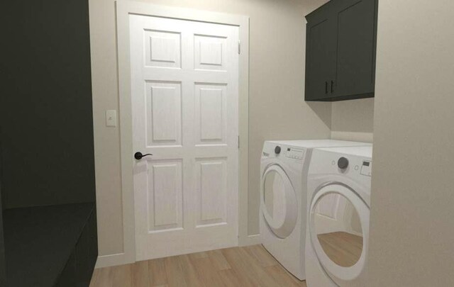 203 W Kobs St, Spencer, WI 54479 - laundry area with cabinet space, washing machine and clothes dryer, and light wood-type flooring