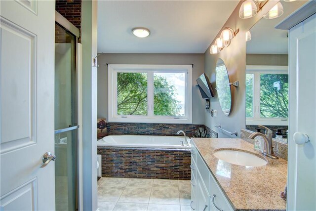 4884 Priory Rd, Eau Claire, WI 54701 - full bathroom with a shower stall, a bath, tile patterned flooring, and vanity