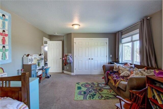 4884 Priory Rd, Eau Claire, WI 54701 - carpeted bedroom featuring a closet and baseboards