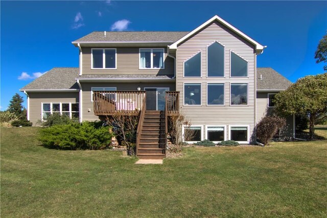 4884 Priory Rd, Eau Claire, WI 54701 - rear view of property with a shingled roof, stairway, a deck, and a lawn