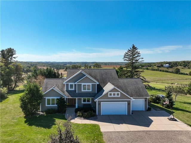 4884 Priory Rd, Eau Claire, WI 54701 - view of front of property with a front lawn, an attached garage, and concrete driveway