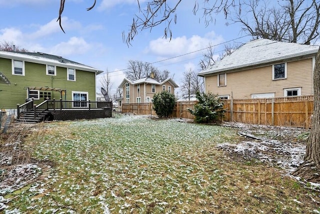 view of yard with a fenced backyard and a deck