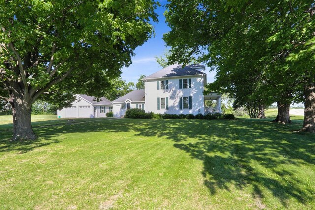 W512 Hafs Rd, Genoa City, WI 53128 - view of front of property with stucco siding, an attached garage, and a front yard