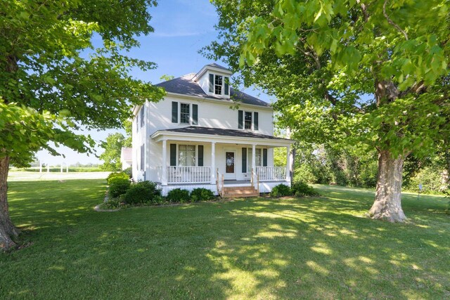 W512 Hafs Rd, Genoa City, WI 53128 - traditional style home with covered porch, a shingled roof, and a front yard