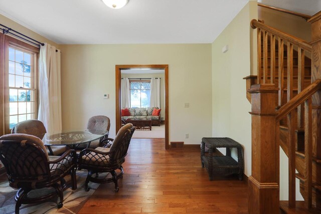 W512 Hafs Rd, Genoa City, WI 53128 - dining room with baseboards, visible vents, and wood finished floors