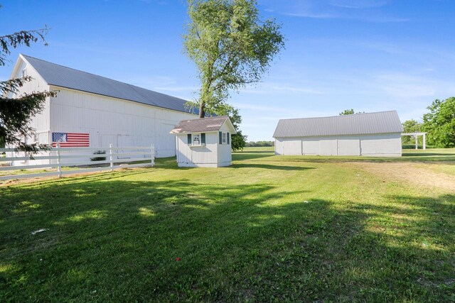 W512 Hafs Rd, Genoa City, WI 53128 - view of yard featuring an outbuilding, fence, and an outdoor structure