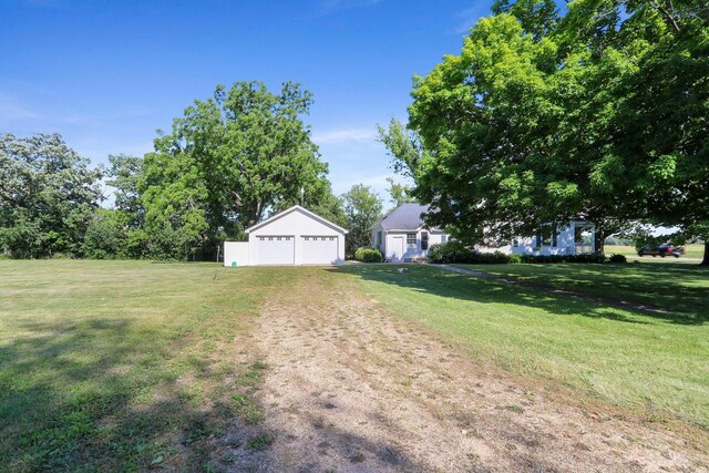 W512 Hafs Rd, Genoa City, WI 53128 - view of yard with an outdoor structure, dirt driveway, and a detached garage