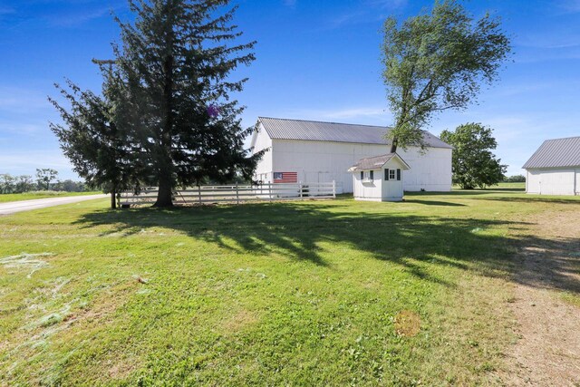 W512 Hafs Rd, Genoa City, WI 53128 - view of yard featuring an outdoor structure and fence