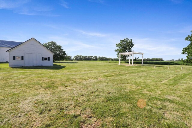 W512 Hafs Rd, Genoa City, WI 53128 - view of yard featuring an outdoor structure, an outbuilding, and a pergola