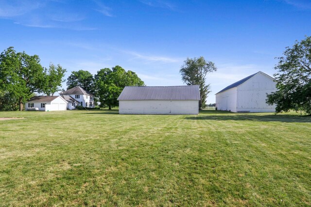 W512 Hafs Rd, Genoa City, WI 53128 - view of yard featuring a pole building and an outdoor structure