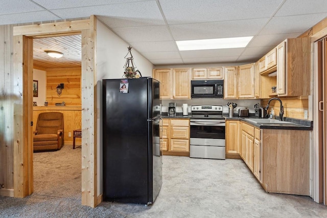 N9805 County Road Aa, Portage, WI 53901 - kitchen featuring black appliances, a sink, dark countertops, light brown cabinetry, and a drop ceiling
