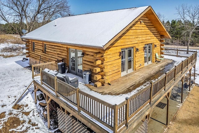 N9805 County Road Aa, Portage, WI 53901 - snow covered house with log exterior and a deck