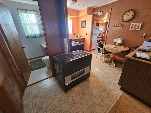 N2709 Lakeshore Dr, Montello, WI 53949 - interior space featuring baseboards, toilet, crown molding, and wood walls