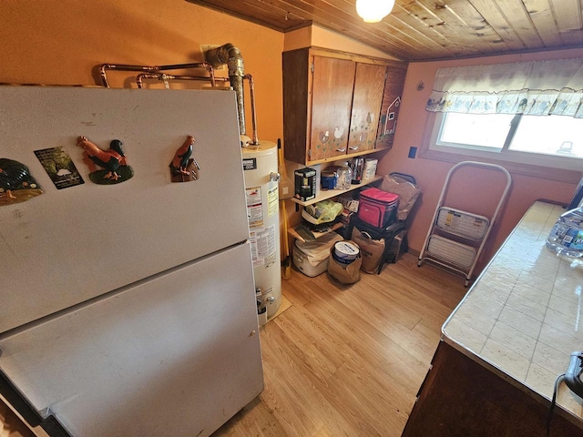 N2709 Lakeshore Dr, Montello, WI 53949 - kitchen featuring water heater, wood ceiling, freestanding refrigerator, light wood-style flooring, and brown cabinetry