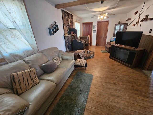 N2709 Lakeshore Dr, Montello, WI 53949 - living room featuring beamed ceiling, ceiling fan, and wood finished floors