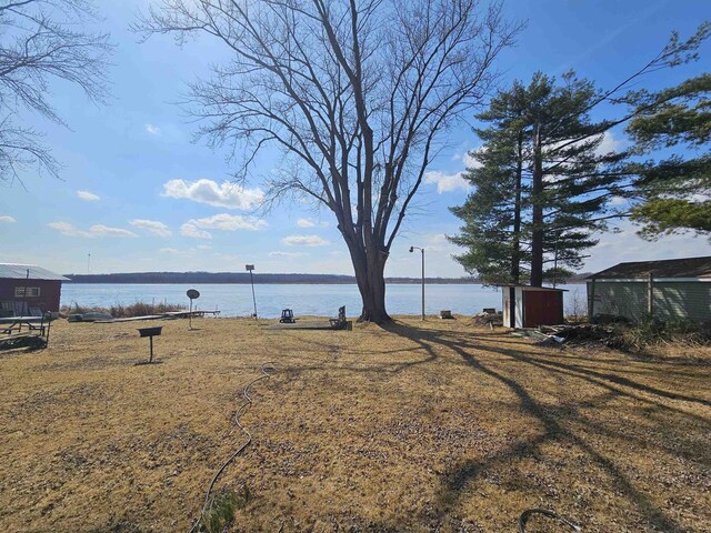 N2709 Lakeshore Dr, Montello, WI 53949 - exterior space with a water view and an outbuilding