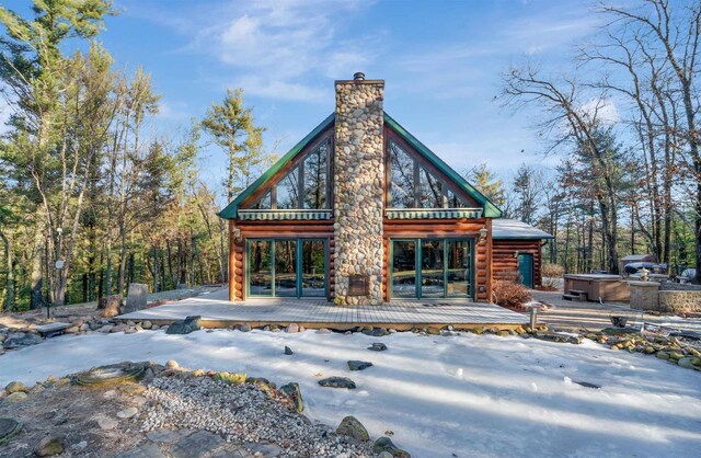 W7113 Bighorn Ct, Wautoma, WI 54982 - rear view of property featuring a chimney, a deck, a hot tub, and log exterior