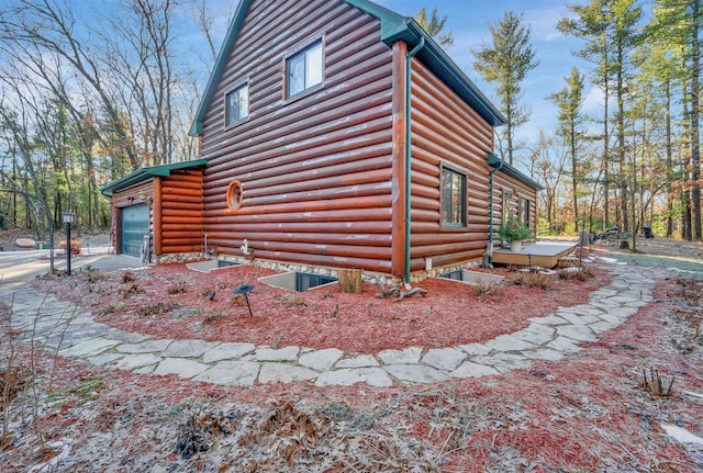 W7113 Bighorn Ct, Wautoma, WI 54982 - view of property exterior with an attached garage