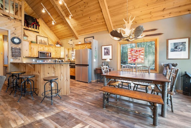 W7113 Bighorn Ct, Wautoma, WI 54982 - kitchen featuring an inviting chandelier, stainless steel appliances, light brown cabinetry, wooden ceiling, and wood finished floors
