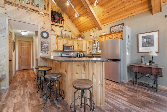 W7113 Bighorn Ct, Wautoma, WI 54982 - kitchen featuring dark wood-style flooring, wooden ceiling, stainless steel appliances, dark countertops, and beam ceiling