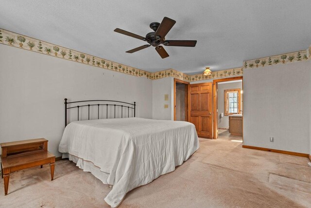 bedroom with light colored carpet, a ceiling fan, baseboards, and a textured ceiling