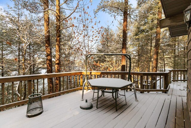 wooden terrace with outdoor dining area