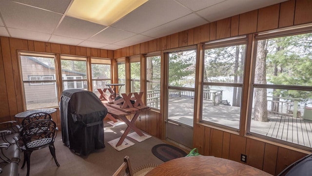 W13573 S Pleasant Rd, Westfield, WI 53964 - sunroom with a paneled ceiling, wooden walls, carpet flooring, and a wooden deck