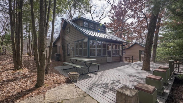 W13573 S Pleasant Rd, Westfield, WI 53964 - rear view of house with a wooden deck, a sunroom, metal roof, and a standing seam roof