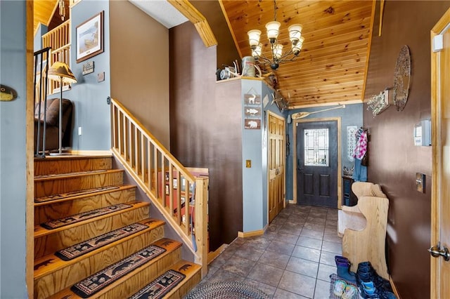 6825 W Lakewood Blvd, Ladysmith, WI 54848 - tiled entryway with lofted ceiling, stairs, baseboards, wood ceiling, and a notable chandelier