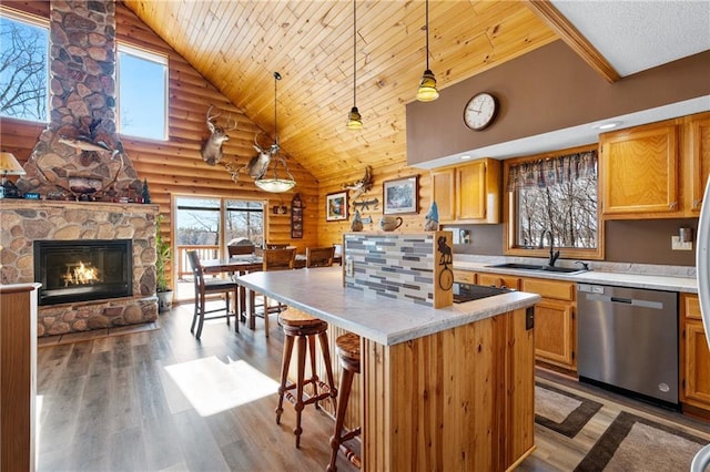 6825 W Lakewood Blvd, Ladysmith, WI 54848 - kitchen featuring a sink, decorative light fixtures, open floor plan, stainless steel dishwasher, and wood ceiling