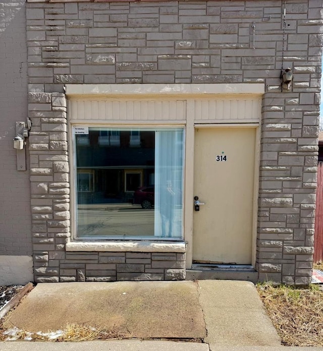 312 S Pearl St, New London, WI 54961 - property entrance with stone siding